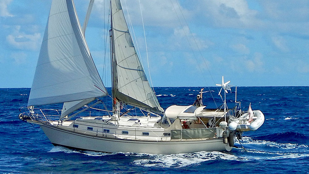 An Island Packet 40 sailboat making good progress under full sail