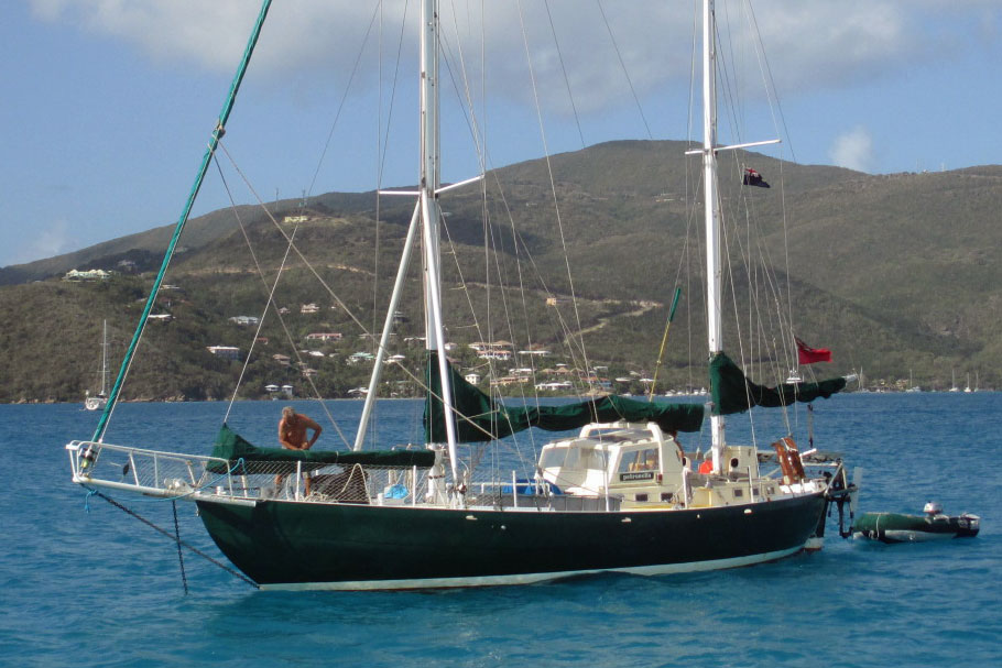 A steel Joshua 42 sailboat dropping the hook off Tortuga in the BVIs