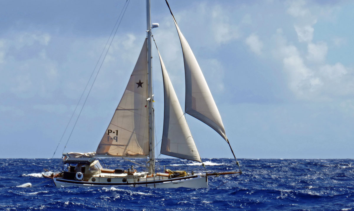 'Pyxis', a Lyle Hess designed cutter on passage in the tradewinds