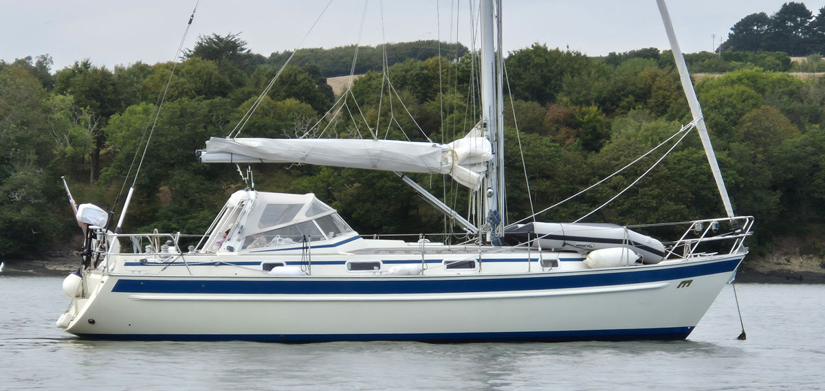A Malo 36 sailboat anchored on the River Lynher in Cornwall, UK