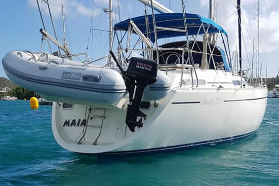 Inflatable dinghy and outboard motor in davits on a Moody 376 sailboat