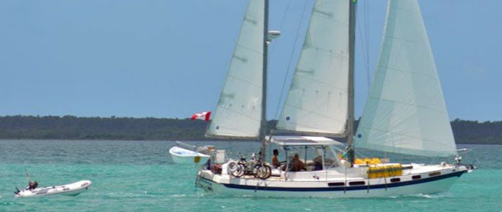 A Morgan 41 Out Island ketch towing her tender