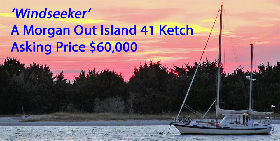 A Morgan 41 Out Island ketch at anchor as the sun sets