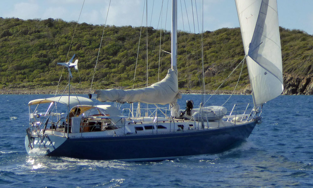 A Newport 41 cruising yacht sailing into Jolly Harbour anchorage in Antigua, West Indies.