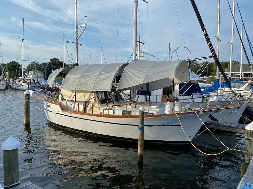 A Nauticat 33 with a full deck awning