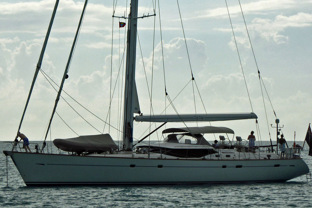 'Zig Zag', an Oyster 82 cutter-rigged sailboat dropping the hook in the Five Islands anchorage in Antigua in the West Indies