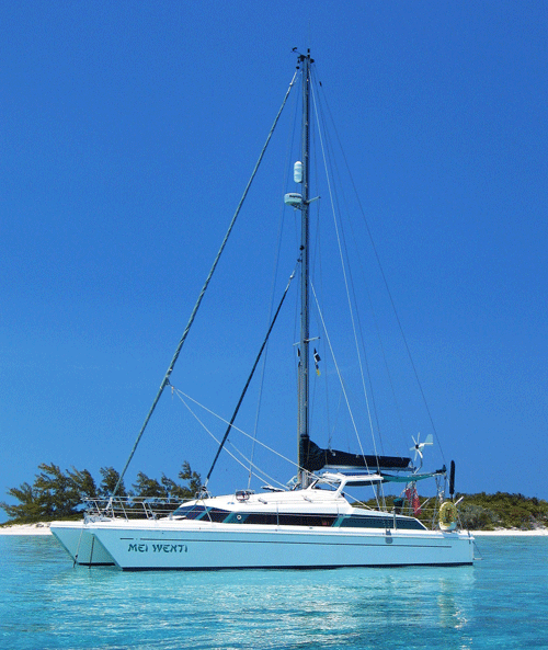 A cutter rigged Prout Snowgoose 37 cruising catamaran in a tropical anchorage