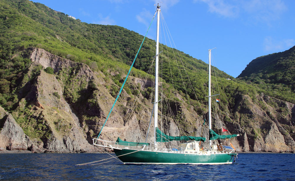 A sailboat moored in Wells Bay, Saba