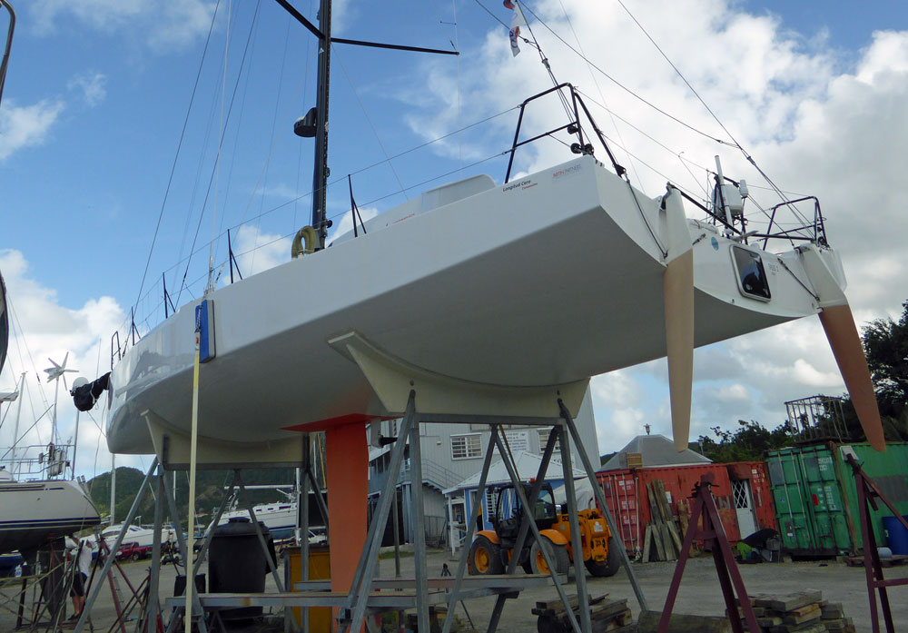 Racing sailboat hull in cradle ashore