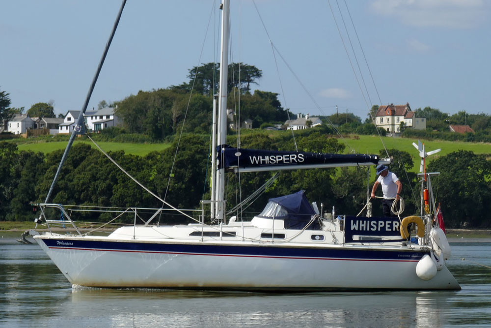 A Westerly Seahawk 35 sailboat motoring slowly up-river