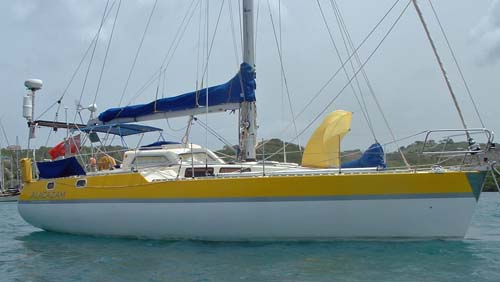 Our self-build sailboat 'Alacazam' at anchor in Prickly Bay, Grenada, West Indies