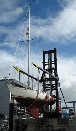 Using a large fork lift specifically designed to handle boats