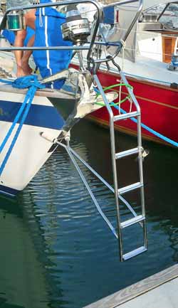A bow ladder hung from the pushpit of a Hallberg-Rassey 42.