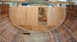 Hull interior of a part-completed cedar strip sailboat