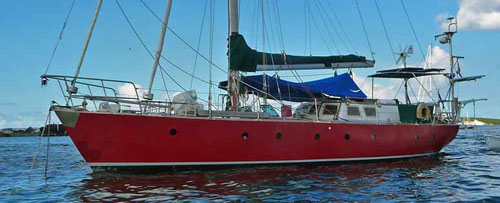 A ferrocement-hulled sailboat at anchor